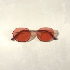 gold metal sunglasses with orange tinted frame